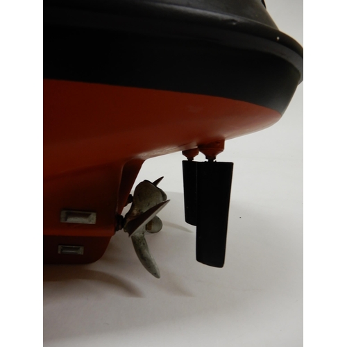 473 - A lot of three assorted model boats, fire rescue craft fitted with petrol motor, 118cm long (46.5