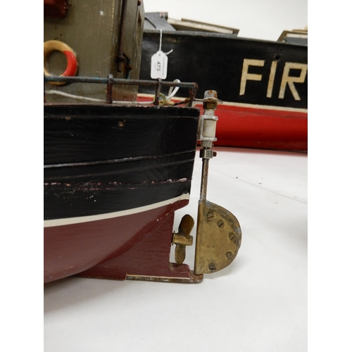 473 - A lot of three assorted model boats, fire rescue craft fitted with petrol motor, 118cm long (46.5