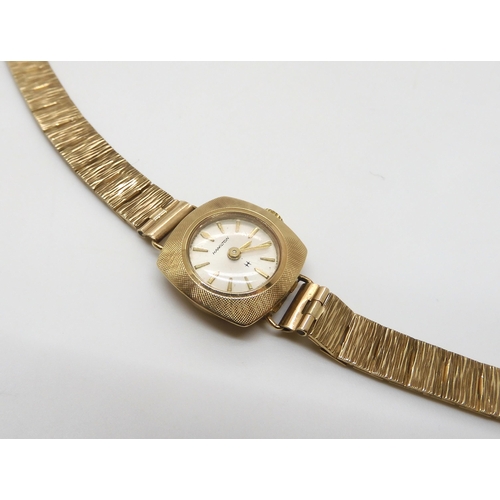 503 - A ladies 9ct gold Hamilton watch and strap, weight including mechanism 15.2gms