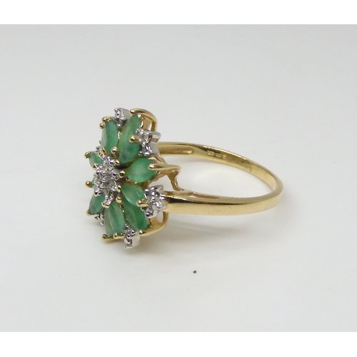 524 - A 9ct gold emerald and diamond flower ring, finger size O1/2, weight 3.1gms