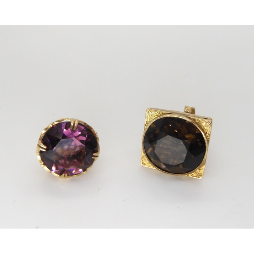 548 - Two 9ct gold decorative fob seal pendants, one set with a large smoky quartz, the other a purple gla... 