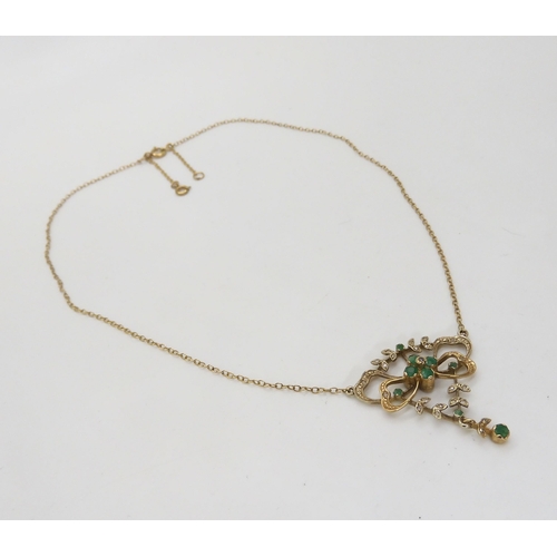 557 - A 9ct gold emerald and diamond Edwardian style necklace, length of chain approx 42cm, weight 5.9gms,... 