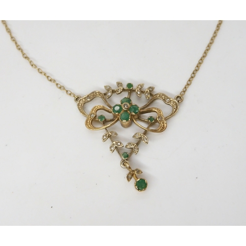 557 - A 9ct gold emerald and diamond Edwardian style necklace, length of chain approx 42cm, weight 5.9gms,... 