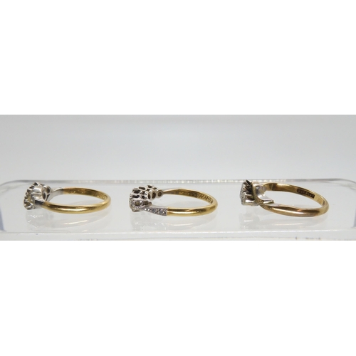 567 - Two 18ct gold vintage diamond rings both with illusion settings, three stone size J1/2, five stone L... 