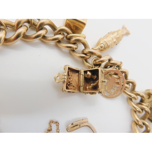 2720 - A 9CT GOLD CHARM BRACELETthe end links and the heart shaped clasp both hallmarked 9.375 (9ct). With ... 