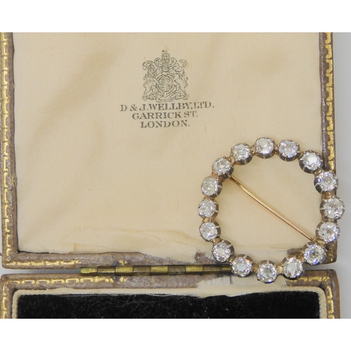 2723 - A DIAMOND CIRCLE BROOCH set with estimated approx 3ct of old cut diamonds, in cut back white metal s... 