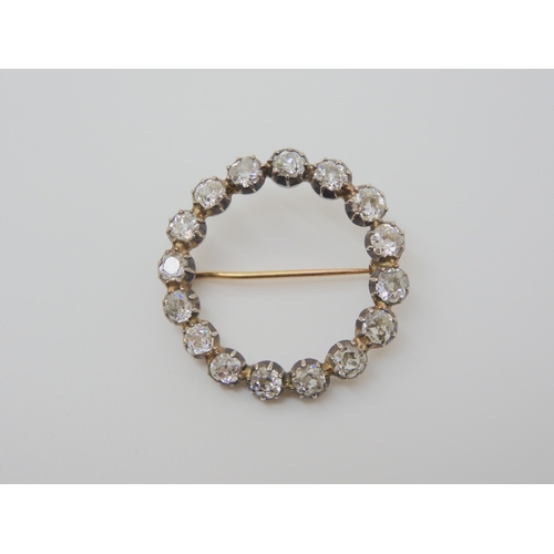 2723 - A DIAMOND CIRCLE BROOCH set with estimated approx 3ct of old cut diamonds, in cut back white metal s... 