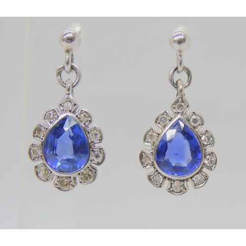 2732 - A PAIR OF SAPPHIRE & DIAMOND EARRINGSThe pear shaped sapphires are approx 6.8mm x 5.4mm, surroun... 