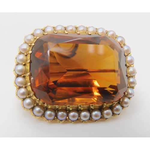 2733 - A 15CT GOLD CITRINE AND PEARL BROOCHset with a 25mm x 18mm x 12mm cognac colour citrine in cut back ... 