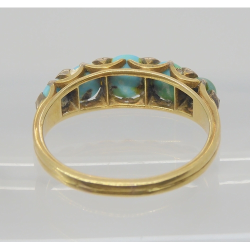 2735 - A TURQUOISE AND DIAMOND RINGset throughout in bright yellow and white metal, with a scalloped galler... 