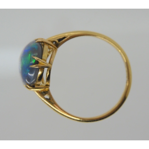 2739 - AN OPAL RING AND OTHER ITEMSThe solid black opal has lively green, purple and blue colour play, and ... 
