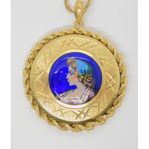 2740 - AN ENAMELLED PENDANT OF A MAIDENmounted in a bright yellow metal, diamond cut and wire work mount, d... 