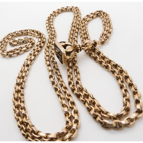 2751 - A 9CT GOLD GUARD CHAIN & FOBstamped 9c to the lobster claw clasp, length 148cm, with a 9ct gold ... 