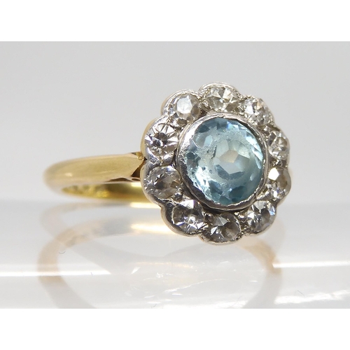 2753 - A BLUE ZIRCON AND DIAMOND RINGset in 18ct yellow gold and platinum. The zircon is approx 5.5mm in di... 