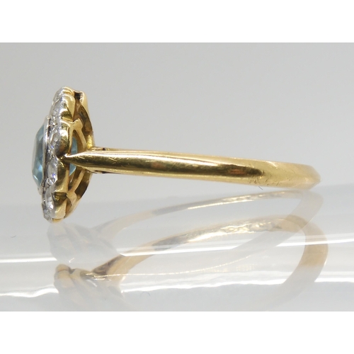 2753 - A BLUE ZIRCON AND DIAMOND RINGset in 18ct yellow gold and platinum. The zircon is approx 5.5mm in di... 
