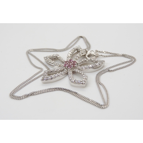 2757 - A DIAMOND SET FLOWER PENDANTset throughout in 18ct white gold, with a cluster of pink gemstones to t... 