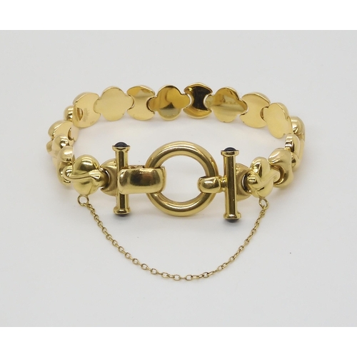 2758 - AN 18CT GOLD BRACELETWith fancy shiny and textured links with onyx terminals to the clasp. Length ap... 