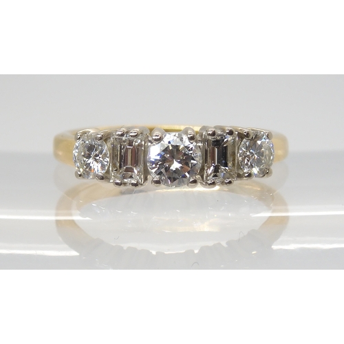 2759 - A BRILLIANT AND BAGUETTE CUT DIAMOND RINGmounted in 18ct yellow and white gold, set with estimated a... 