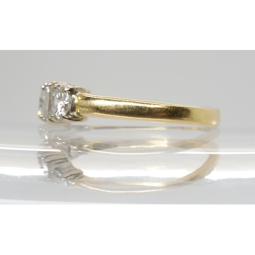2759 - A BRILLIANT AND BAGUETTE CUT DIAMOND RINGmounted in 18ct yellow and white gold, set with estimated a... 