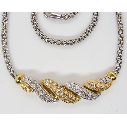 2760 - AN 18CT GOLD DIAMOND NECKLETset throughout in yellow and white gold, with pave set diamonds to the t... 