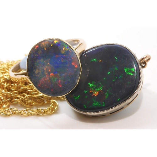 2764 - A BLACK OPAL PENDANT WITH SIMILAR RINGthe pendant mounted in 9ct gold appears to be a solid piece of... 