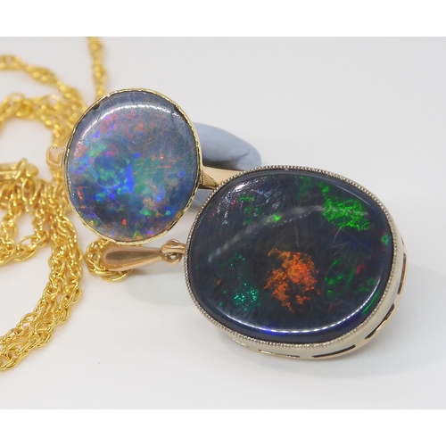 2764 - A BLACK OPAL PENDANT WITH SIMILAR RINGthe pendant mounted in 9ct gold appears to be a solid piece of... 