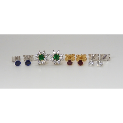 2766 - AN 18CT DIAMOND FLOWER EARRING SETwith interchangeable centres, of ruby, emerald and sapphire. Weigh... 