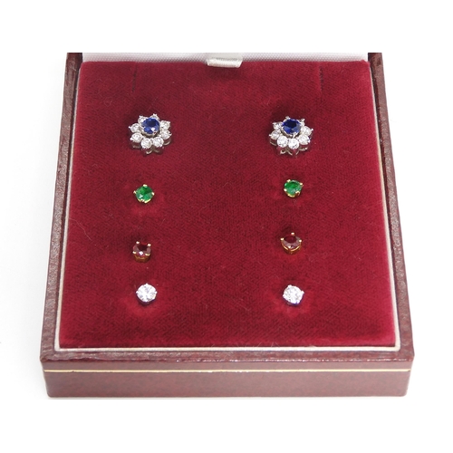 2766 - AN 18CT DIAMOND FLOWER EARRING SETwith interchangeable centres, of ruby, emerald and sapphire. Weigh... 