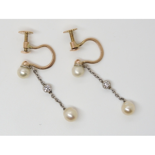 2773 - A PAIR OF PEARL & DIAMOND EARRINGSmounted in yellow 9ct gold and white metal, the pearl studs to... 