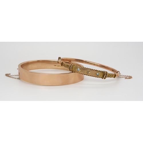 2781 - TWO VINTAGE BANGLESa 9ct gold opal and diamond Etruscan revival style bangle, with granulation and w... 