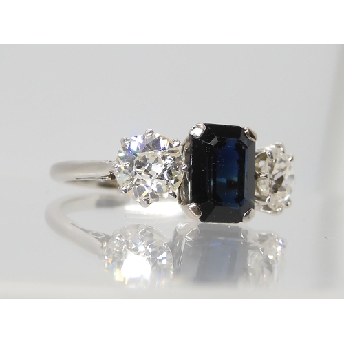 2785 - A SAPPHIRE AND DIAMOND THREE STONE RINGset throughout in white metal, the two diamonds have an estim... 
