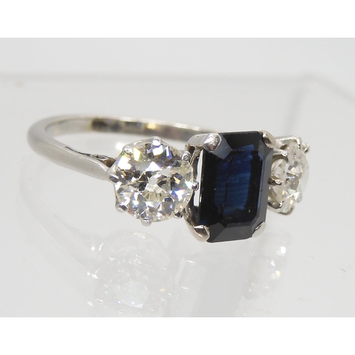 2785 - A SAPPHIRE AND DIAMOND THREE STONE RINGset throughout in white metal, the two diamonds have an estim... 