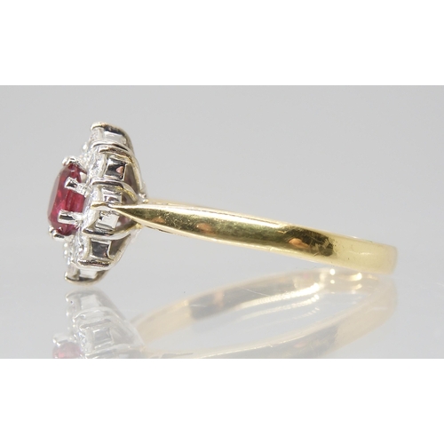 2786 - A RUBY & DIAMOND FLOWER RINGmounted throughout in 18ct yellow gold, set with estimated approx 0.... 