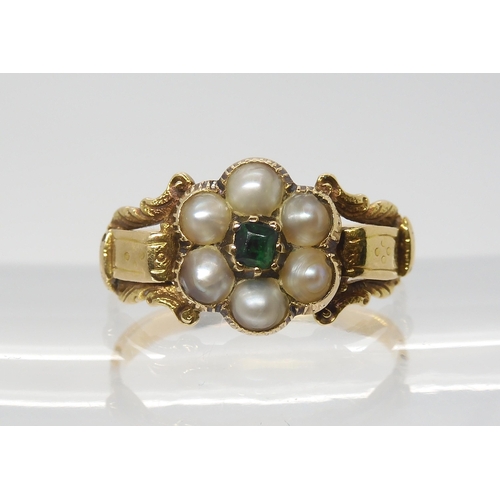 2790 - A VICTORIAN FLOWER RINGmounted in bright yellow metal set with split pearls and a green gem, finger ... 