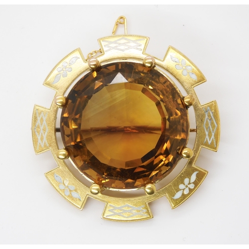 2791 - A VICTORIAN LARGE CITRINE BROOCHset in a bright yellow metal and enamelled brooch mount, the citrine... 
