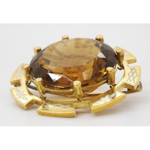 2791 - A VICTORIAN LARGE CITRINE BROOCHset in a bright yellow metal and enamelled brooch mount, the citrine... 