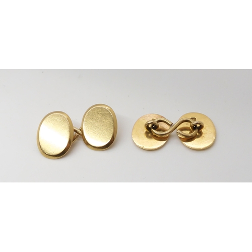 2796 - A PAIR OF GOLD CUFFLINKSwith plain polished faces, stamped 18 to the reverse. Weight 15.6gms ... 