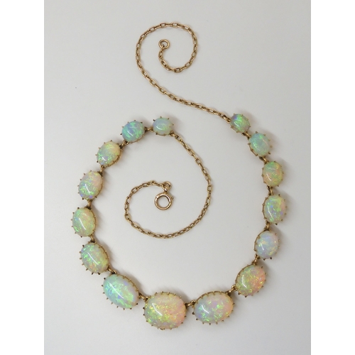 2798 - A SUBSTANTIAL OPAL NECKLACEmounted in 15ct gold throughout with delicate multi claw crown settings. ... 