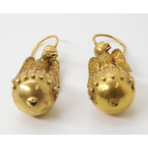 2804 - A PAIR OF ETRUSCAN REVIVAL EARRINGSa granulation and wire work decorated ball surmounted by an eagle... 