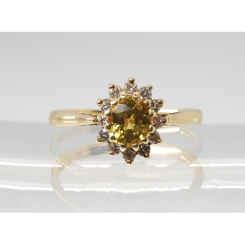 2807 - A YELLOW SAPPHIRE AND DIAMOND CLUSTER RINGset throughout in 18ct yellow gold, finger size N, weight ... 