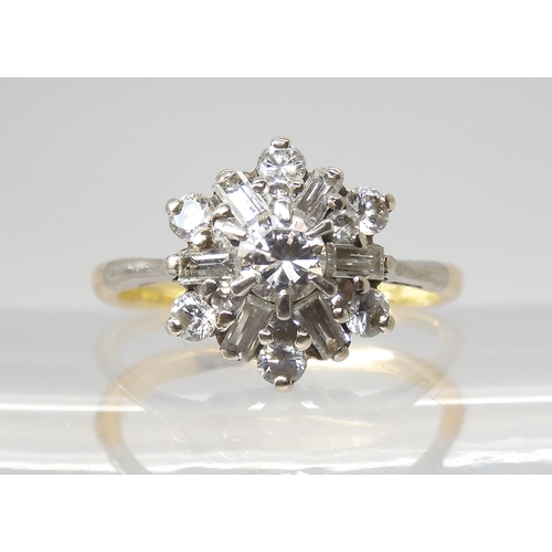 2808 - A DIAMOND CLUSTER RINGset with estimated approx 0.68cts of brilliant and baguette cut diamonds, set ... 