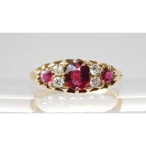 2810 - A CLASSIC RUBY & DIAMOND CLUSTERmounted throughout in bright yellow metal (partial hallmarks) th... 