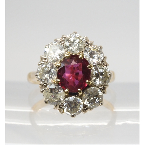 2812 - A SUBSTANTIAL RUBY & DIAMOND CLUSTER RINGthe central ruby measures 7.2mm x 6.4mm x 3mm and is su... 