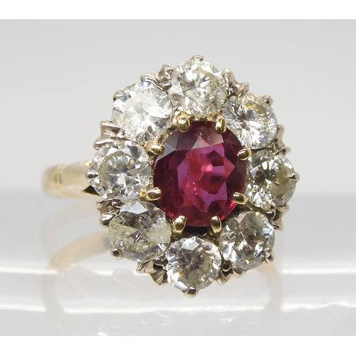 2812 - A SUBSTANTIAL RUBY & DIAMOND CLUSTER RINGthe central ruby measures 7.2mm x 6.4mm x 3mm and is su... 