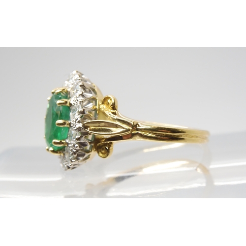 2813 - AN EMERALD & DIAMOND CLUSTER RINGset throughout in 18ct yellow and white gold, with fleur de lys... 