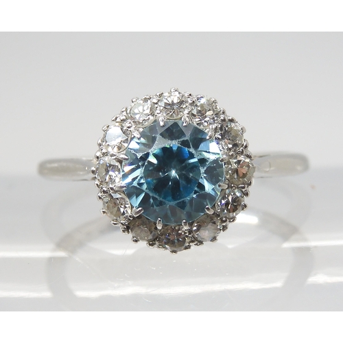 2814 - A BLUE ZIRCON AND DIAMOND RINGset throughout in platinum, the central blue zircon is approx 6.6mm x ... 