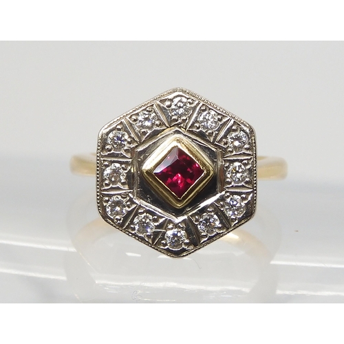 2817 - A STATEMENT RUBY & DIAMOND CLUSTER RINGset with a square ruby of approx 3.7mm x 3.7mm x 2.6mm, t... 