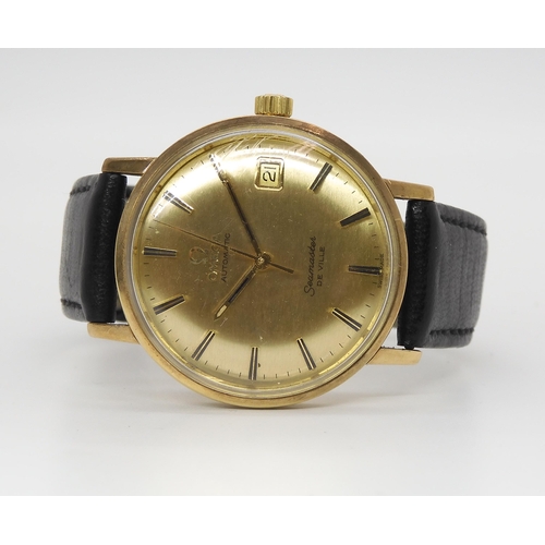 2892 - AN OMEGA SEAMASTER DE VILLE AUTOMATICwith yellow metal case, gold coloured dial, hands and baton num... 