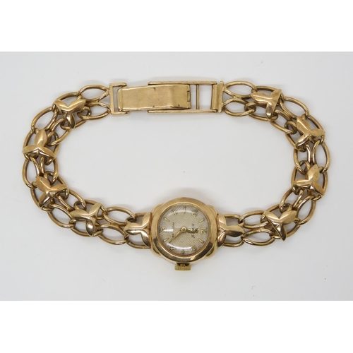 2894 - A 9CT GOLD LADIES VINTAGE ROLEX WATCHwith a decorative leaf pattern strap. The cream textured dial w... 