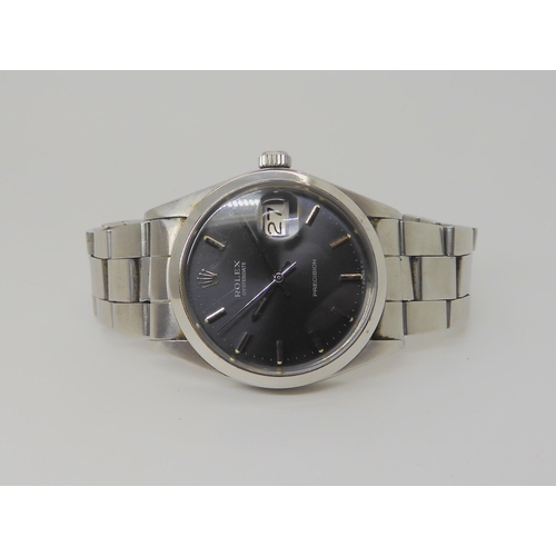 2897 - A ROLEX OYSTERDATE PRECISIONwith dark grey satined dial, silver coloured baton numerals, hands, and ... 